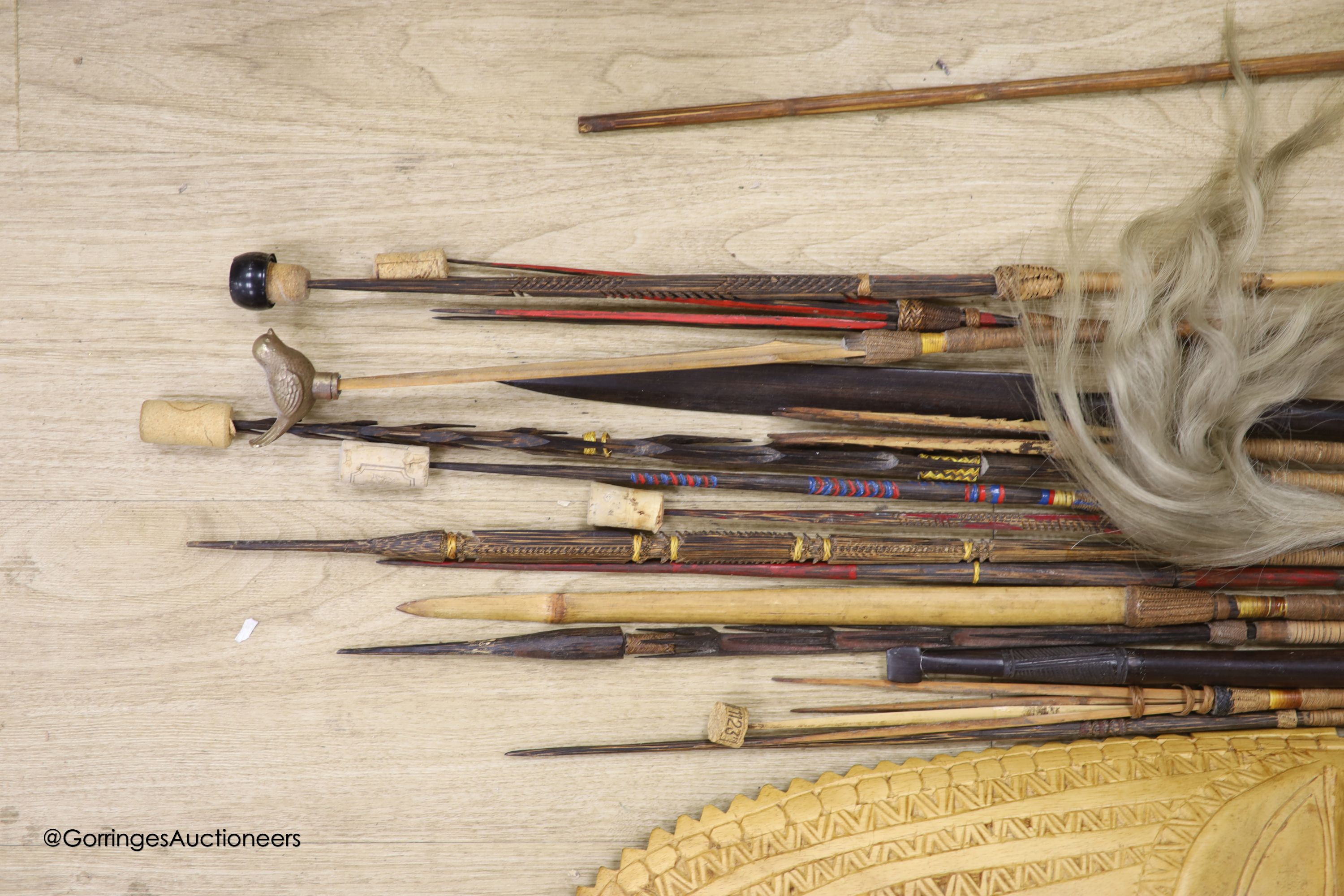 A collection of Tribal style spears etc and a mask